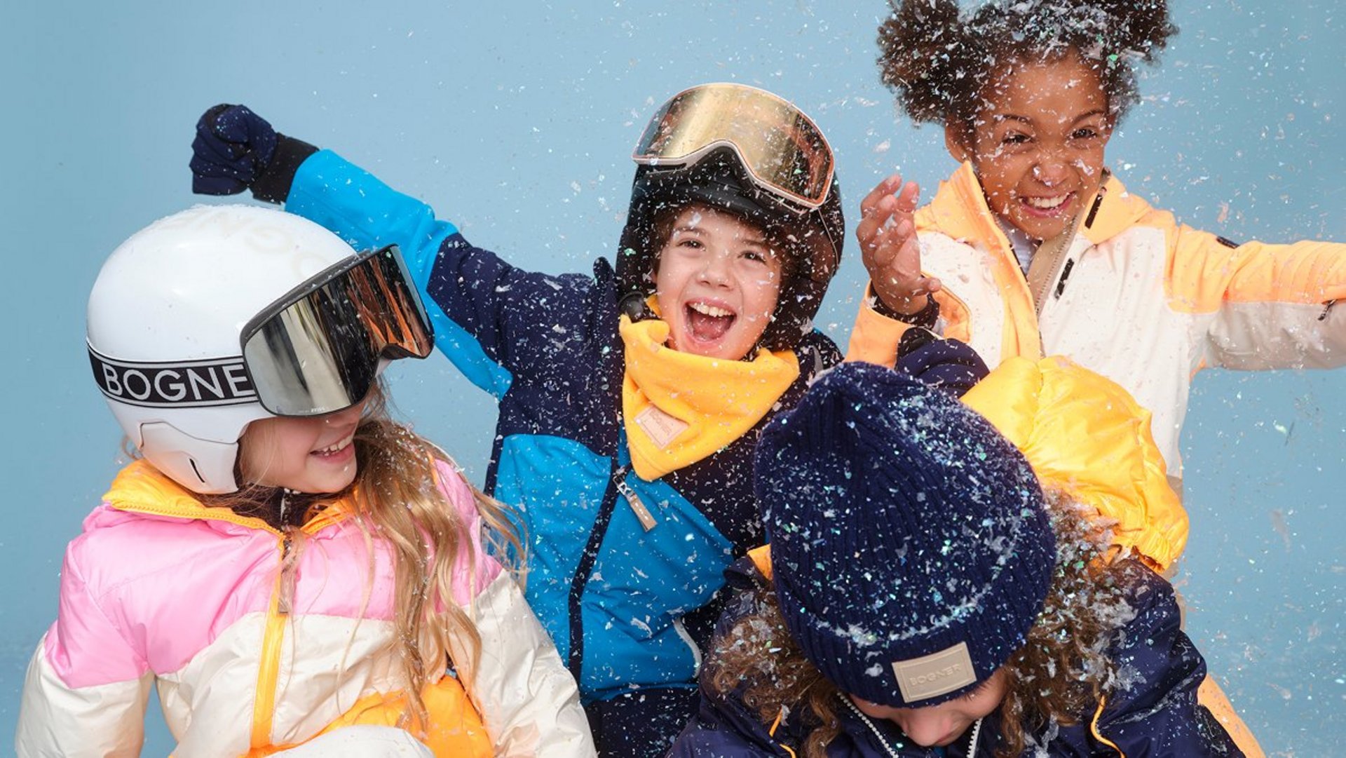 Drei Kinder im Skianzug von Bogner