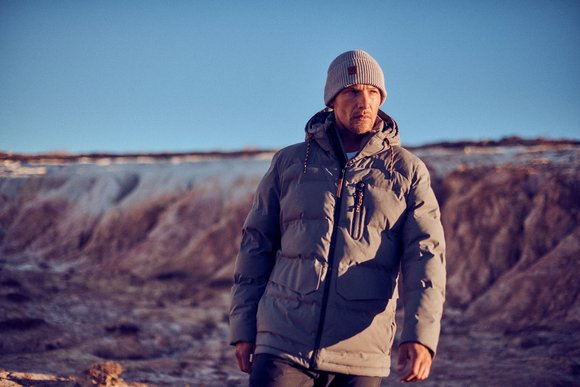 Man in winter jacket and cap